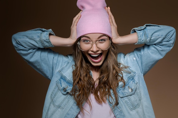 Surprised beautiful woman in jeans jacket