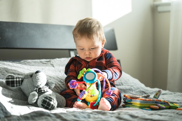 Surprised boy with pyramid and toys in his hands