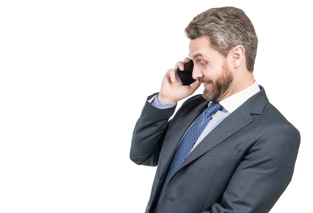 Surprised businessman man talk on mobile phone isolated on white copy space business call