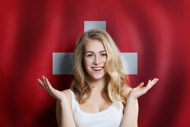 Surprised cute happy girl with Switzerland flag background Travel and education concept