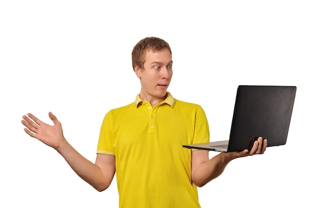 Surprised guy holding laptop in hand isolated on white background