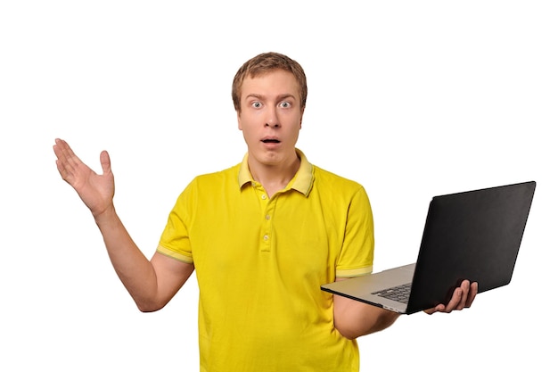 Surprised guy holding laptop in hand isolated on white background