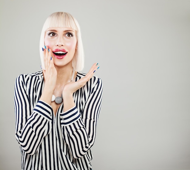 Surprised happy woman with opened mouth Shocked fashion model woman