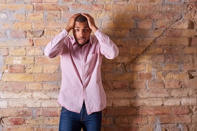 Surprised man in pink shirt