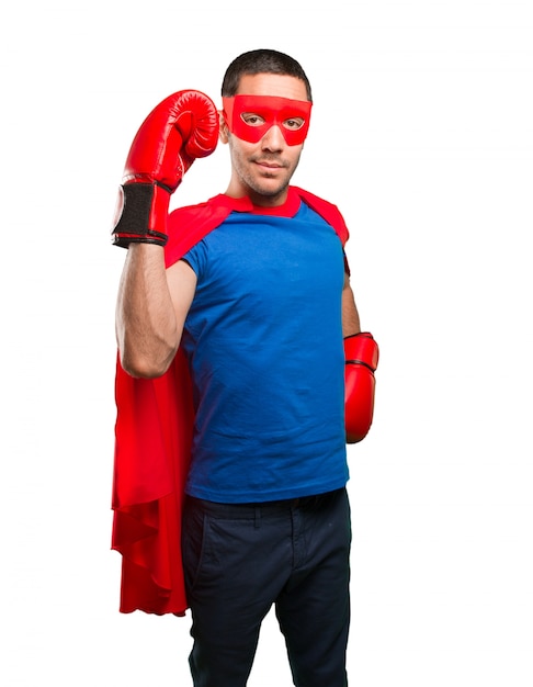 Surprised superhero with a boxing gloves