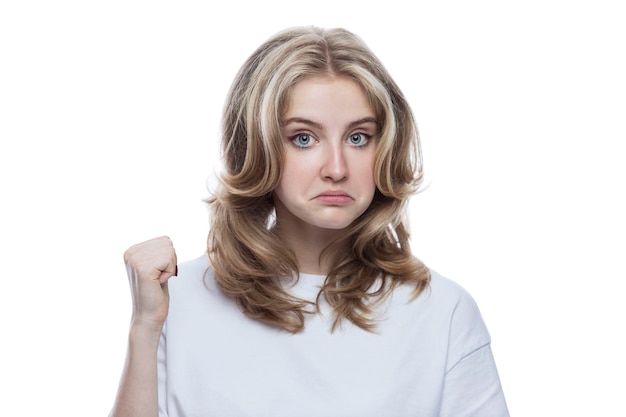 Surprised teen girl in a white Tshirt Emotions and sensitivity Isolated on white background Closeup