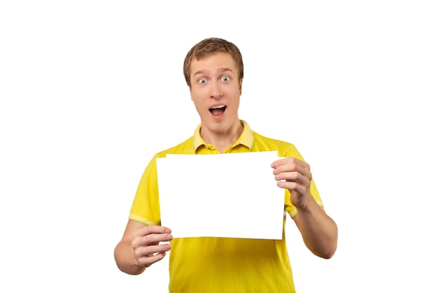 Surprised young man holding blank paper sheet paper mockup isolated on white background