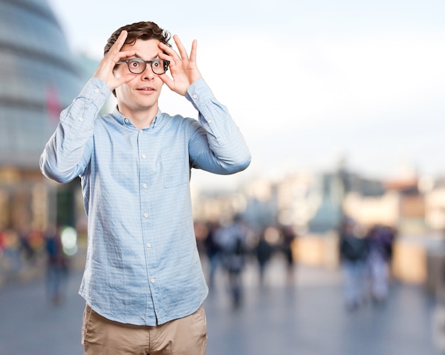 Surprised young man with an observe gesture