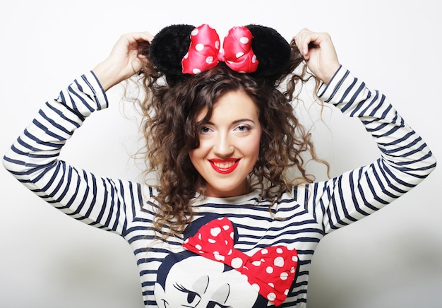 Surprised young woman with mouse ears