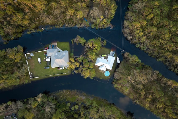 Surrounded by hurricane Ian rainfall flood waters homes in Florida residential area Consequences of natural disaster