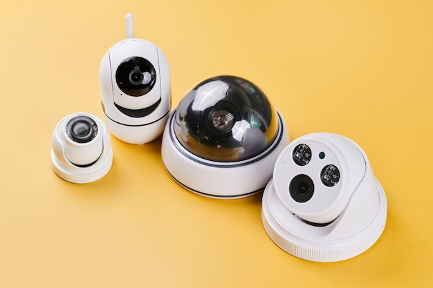 Surveillance cameras set of different videcam cctv cameras isolated on yellow background close up home security system concept