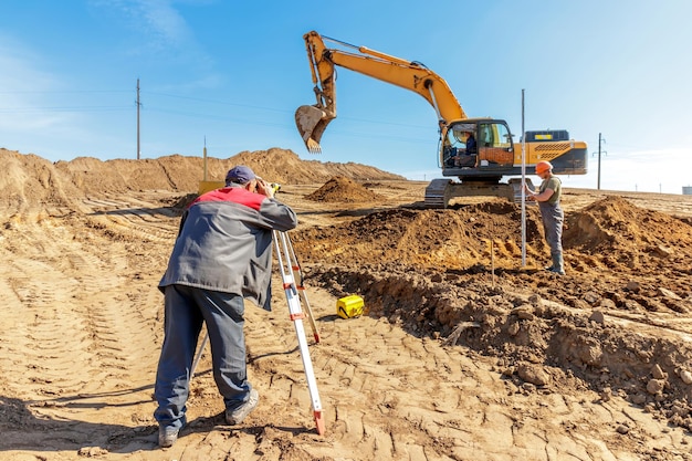 Surveying and Excavation Work at Construction Site