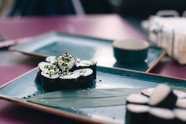 sushi in ceramic dishes sushi with rice cheese and fish