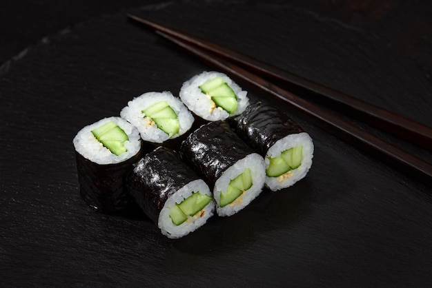 Sushi maki rolls cucumber fresh hosomaki pieces with rice and nori close up of delicious japanese