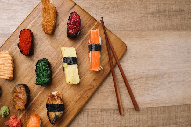 Sushi platter a selection of raw fish and rice snacks on wooden surface