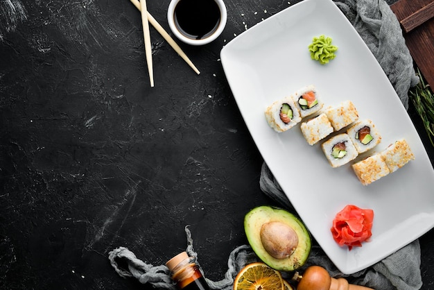 Sushi roll with fish avocado and cucumber Chinese traditional dish Top view Free copy space