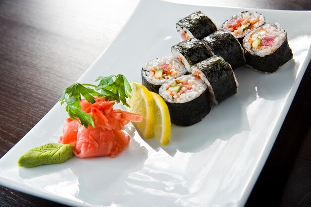 Sushi roll with salmon and shrimp tempura.