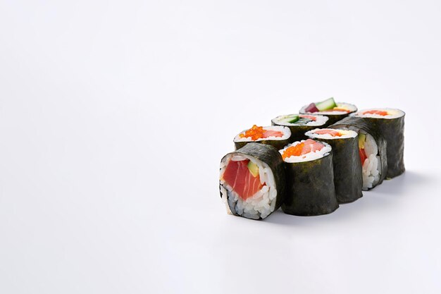 Sushi rolls assortment isolated on white background with copy space japanese food