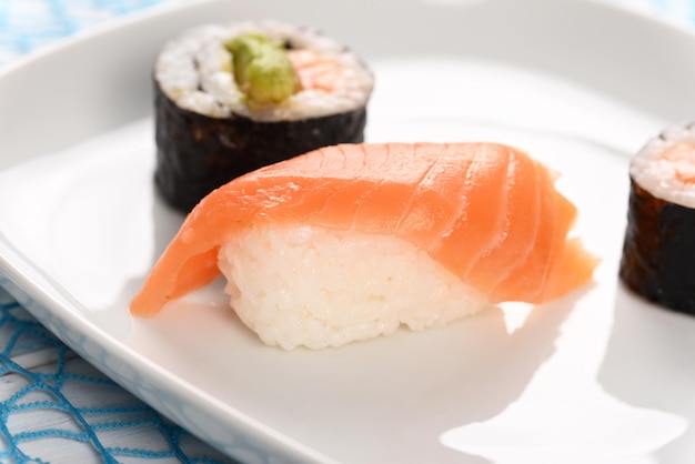 Sushi and rolls on a white plate