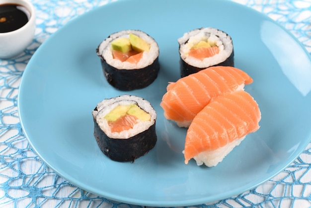 Sushi and rolls on a white plate