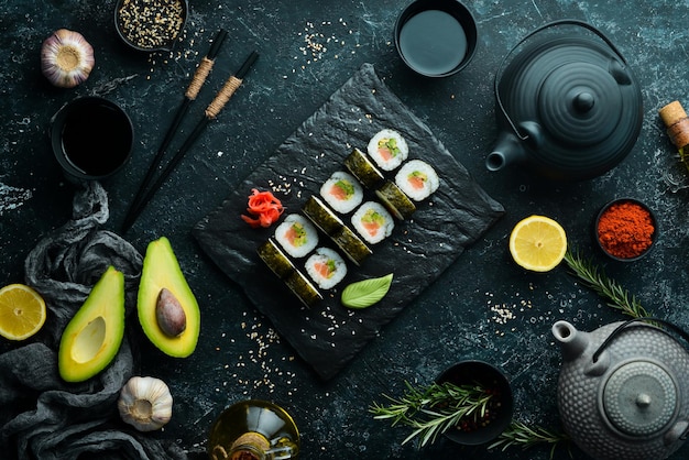 Sushi rolls with avocado and salmon Classic Japanese sushi Top view Free space for your text