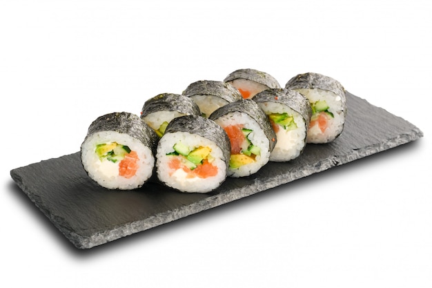 Sushi Rolls with salmon, avocado, cucumber and Cream Cheese inside wrapped in nori leaf