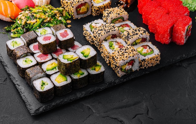 Sushi set on black stone background