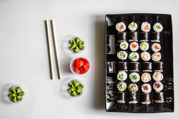 Sushi set closeup on black background Traditional Japanese seafood Delicious roll Advert