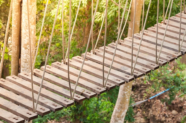 Suspension bridge walkway to the adventurous cross to the other side forest