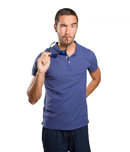 Suspicious young man on white background