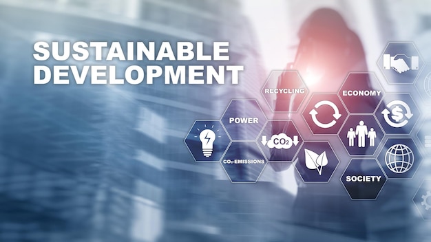 Sustainable development ecology and environment protection concept Renewable energy and natural resources Double exposure of success businessman with abstract building