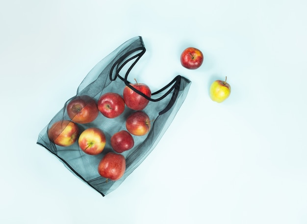 Sustainable eco packaging concept: shopping for groceries with a multi-use bag to reduce ecological footprint