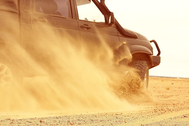 SUV in the desert / old vintage all-terrain vehicle, expedition in the desert on the sand, extreme cars