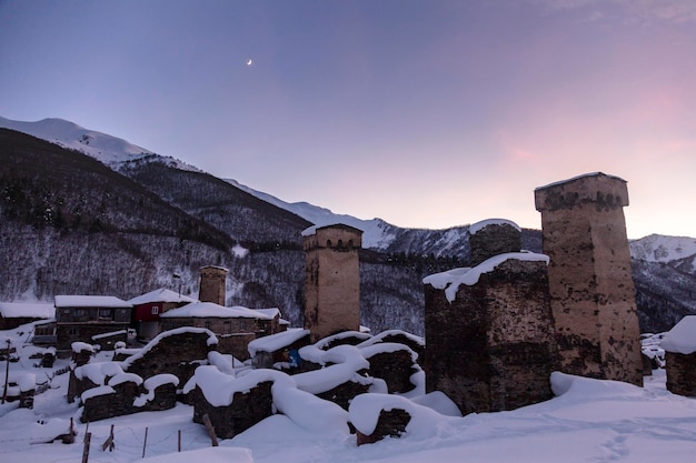 Svan towers durring sunset attached to residential houses in the province of Ushguli are the symbol of Svaneti the Caucasus Georgia