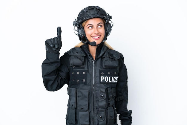 SWAT caucasian woman isolated on white background intending to realizes the solution while lifting a finger up