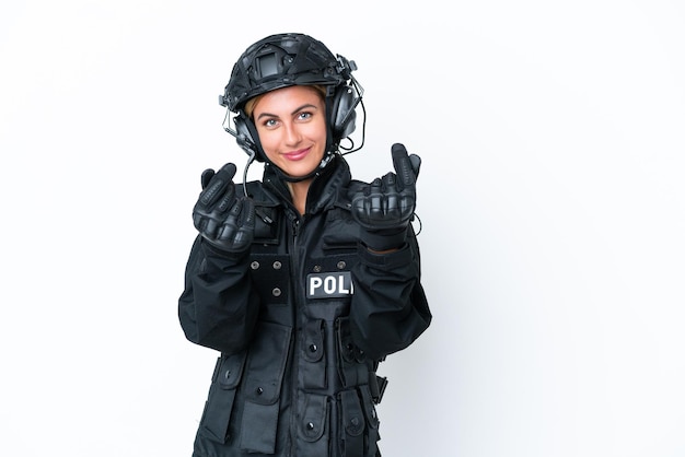 SWAT caucasian woman isolated on white background making money gesture