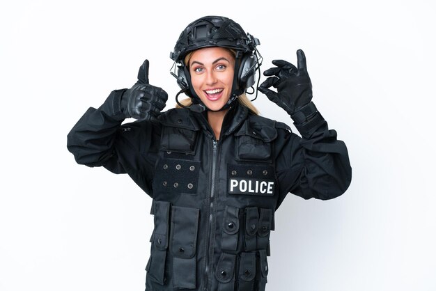 SWAT caucasian woman isolated on white background showing ok sign and thumb up gesture