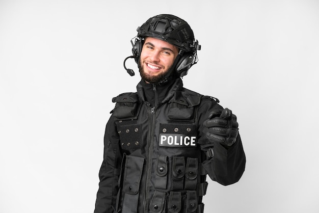 SWAT over isolated white background points finger at you with a confident expression