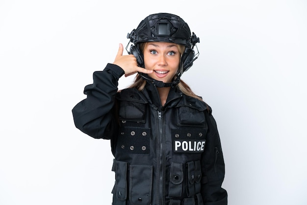 SWAT Russian woman isolated on white background making phone gesture Call me back sign