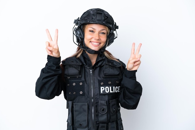 SWAT Russian woman isolated on white background showing victory sign with both hands