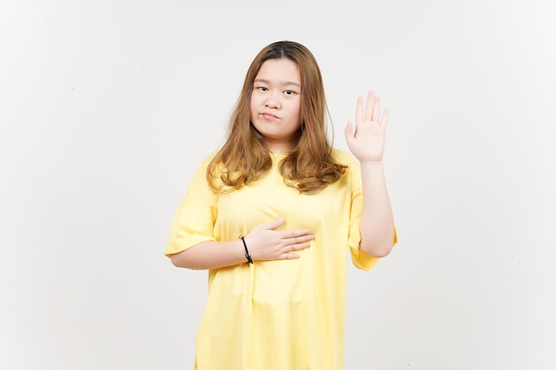 Swearing gesture of Beautiful Asian Woman wearing yellow TShirt Isolated On White Background