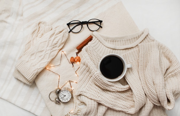  sweater, knitted mittens and Christmas decorations