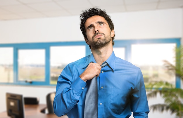 Sweating businessman due to hot climate