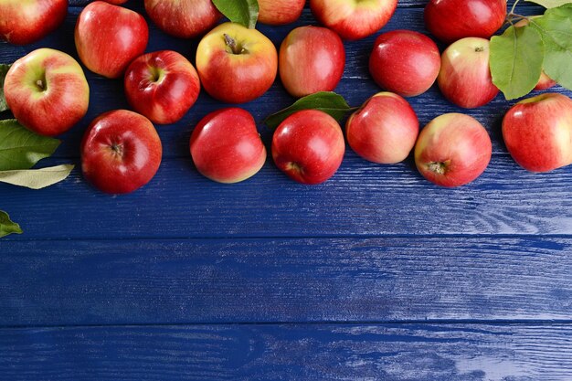 Sweet apples on wooden background