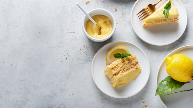 Sweet cake with lemon cream on the light table