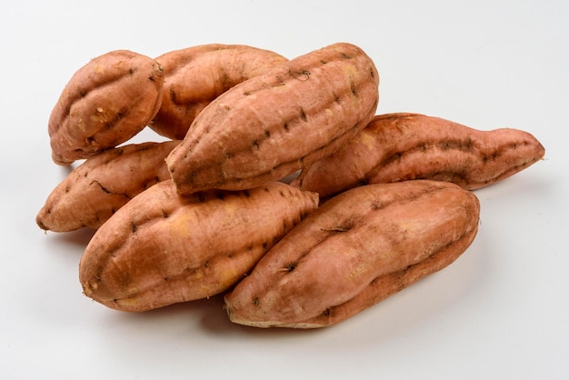 Sweet carrot potatoes isolated on white background