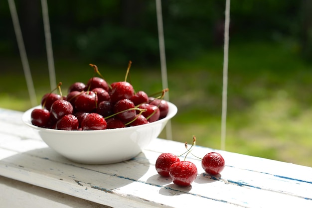 Sweet cherry Red cherry berries in white plate Sweet cherry berries closeup Summer ripe berries