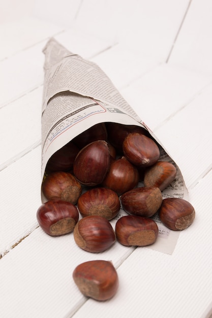 Sweet chestnuts wrapped in newspaper