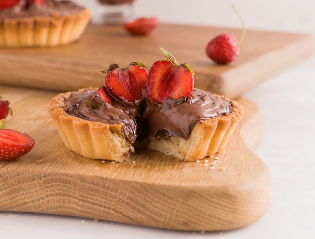 Sweet chocolate dessert tart with berries. Close-up