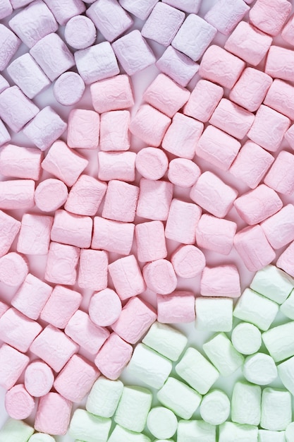 Sweet colorful Marshmallow Pattern. Background from bright marshmallows close up. Pastel colored dessert. Top view.